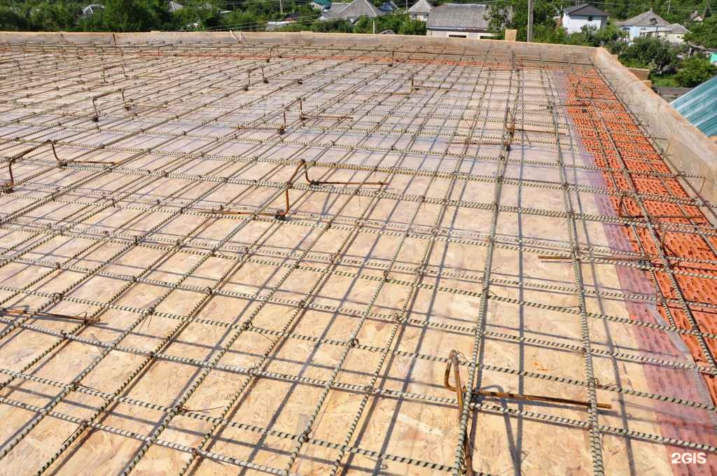 A concrete slab being poured for a house.