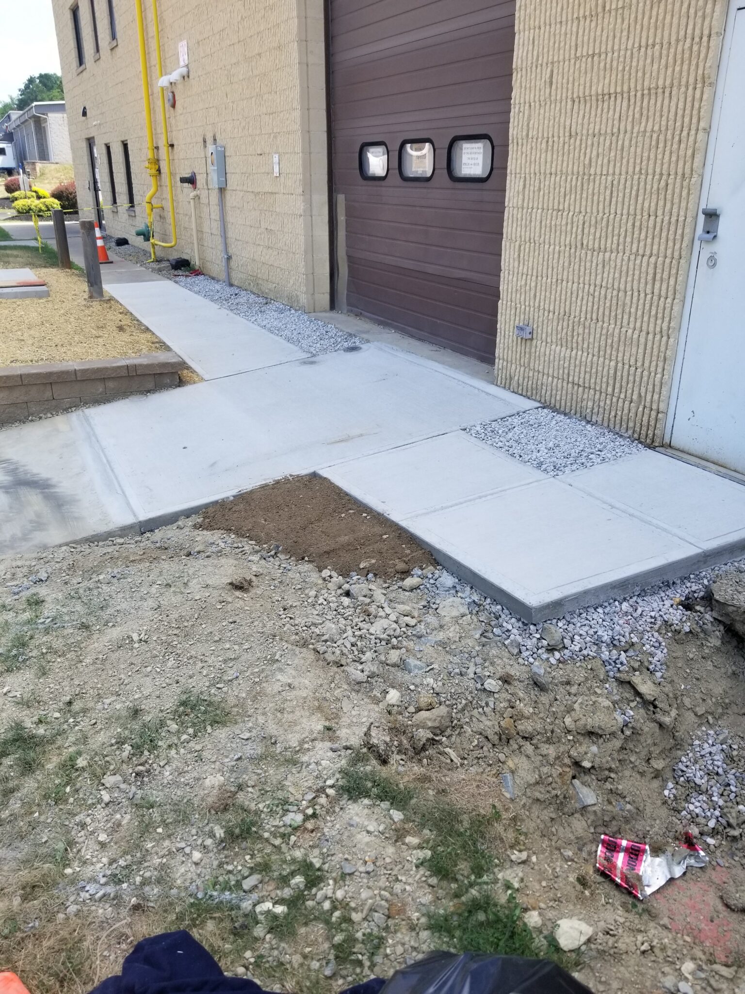 A sidewalk that has been laid out and is being installed.