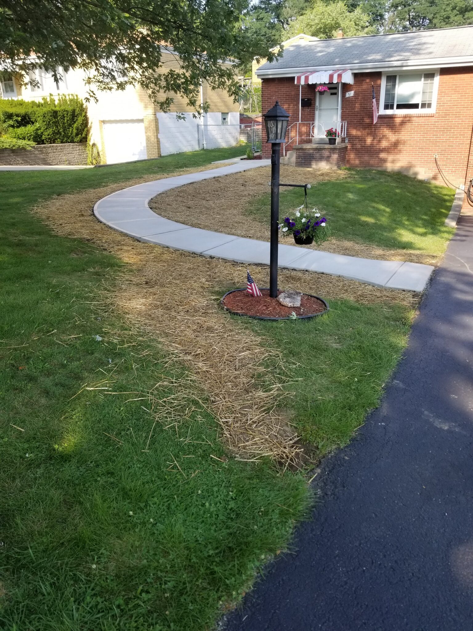 A fire hydrant in the middle of a yard.