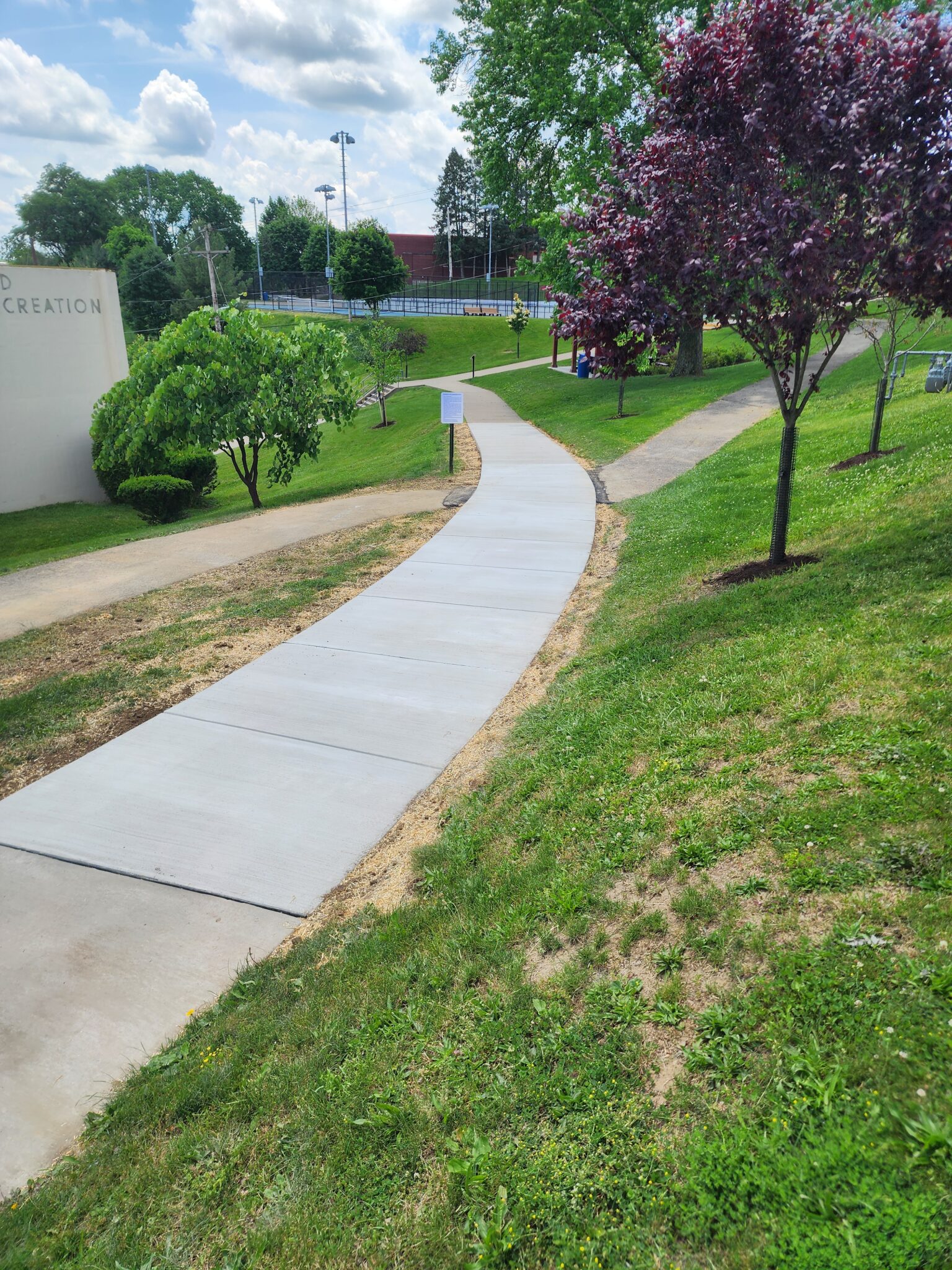 A walkway that is going down the side of a hill.