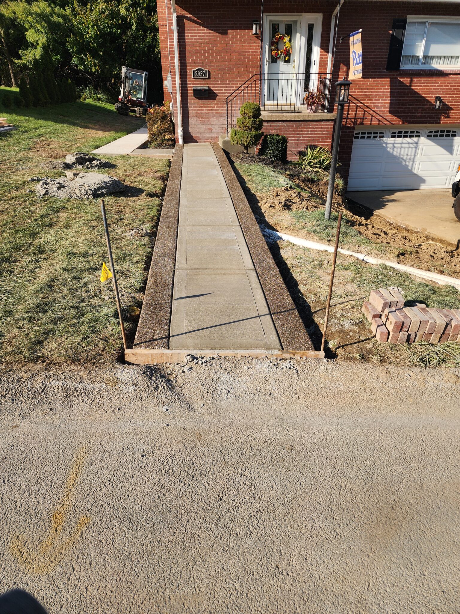 A concrete walkway that is being built.