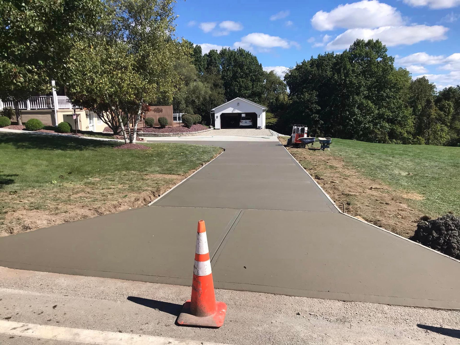 A road with a cone on the side of it