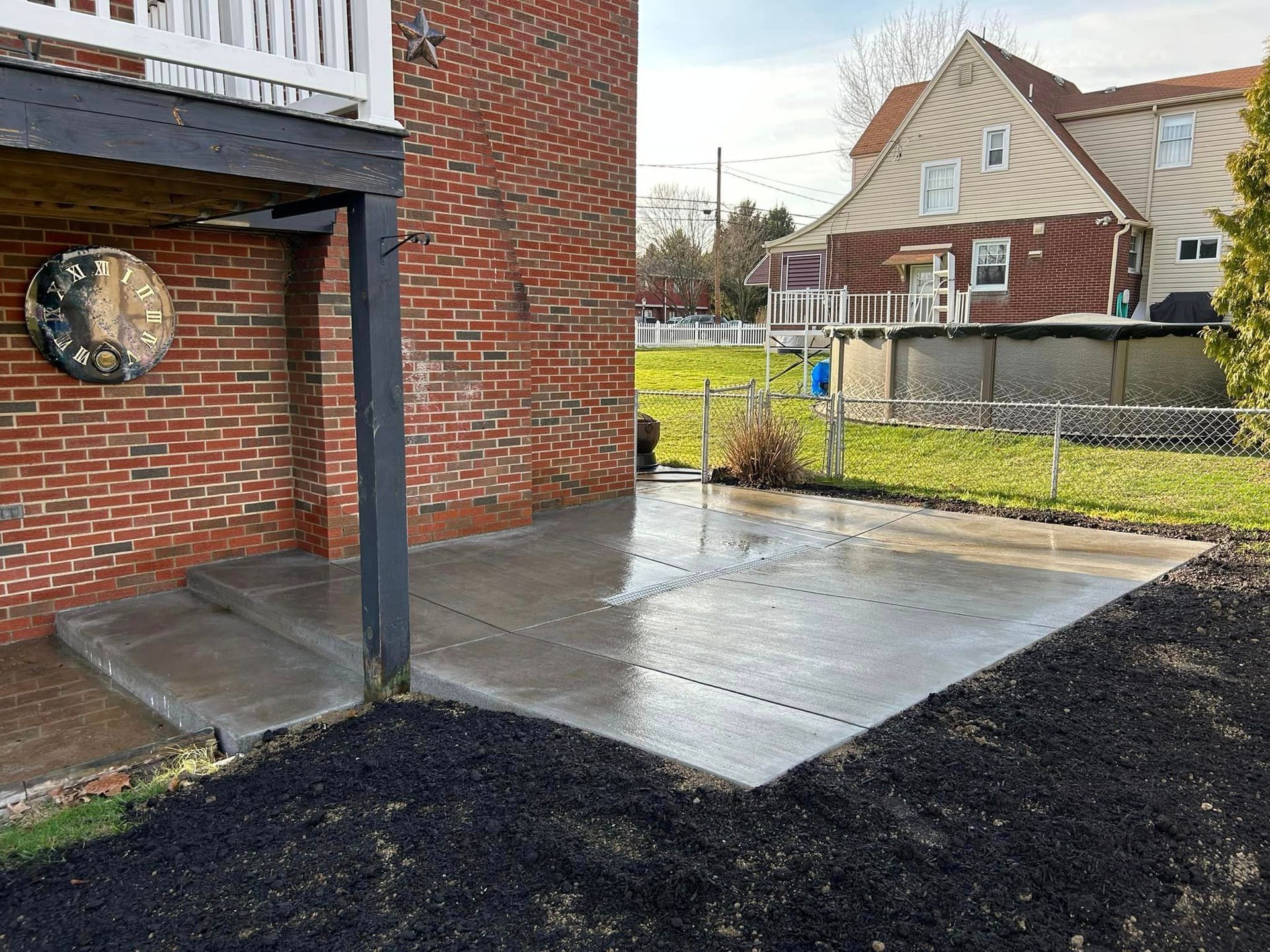 334783102_222815310206030_6147992303611898277_n-1920w A concrete slab that has been laid in the middle of a yard.