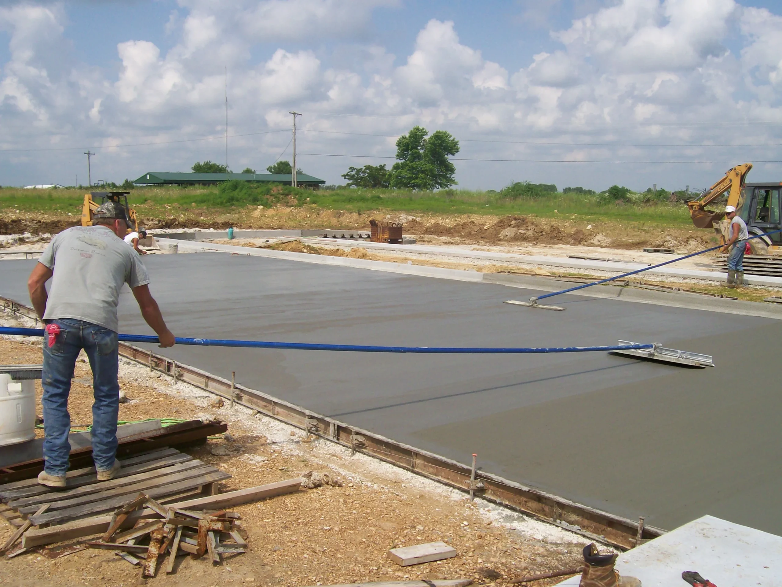 A man standing on top of a cement slab.