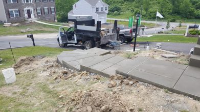 A truck is parked on the side of the road.
