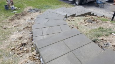 A concrete path that has been laid in the ground.