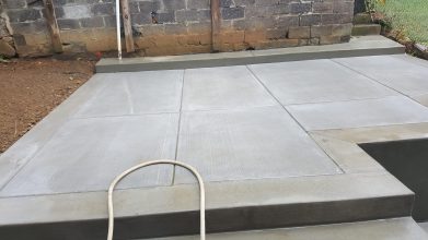 A sidewalk with concrete and cement in it.
