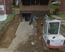 A white truck parked in front of a house.