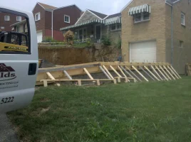 A white van parked in front of a house.