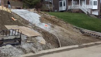A view of the side of a house that is being demolished.