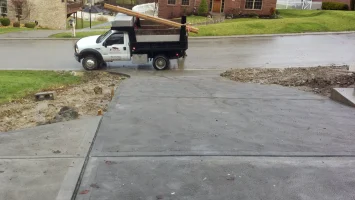 A white truck parked on the side of a road.