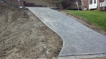 A concrete walkway that is being built.