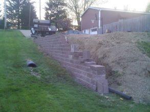 A truck is parked in front of the steps.